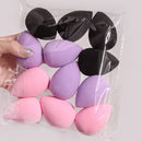 Kit with 12 multicolored makeup sponges.